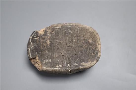 An ancient Egyptian pottery scarab beetle, with hieroglyphic inscriptions length 7.5cm